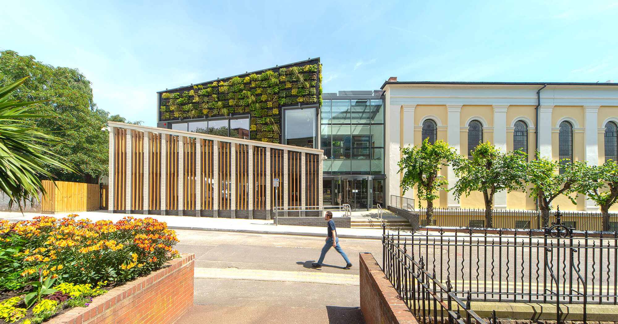 Man walking in front of building